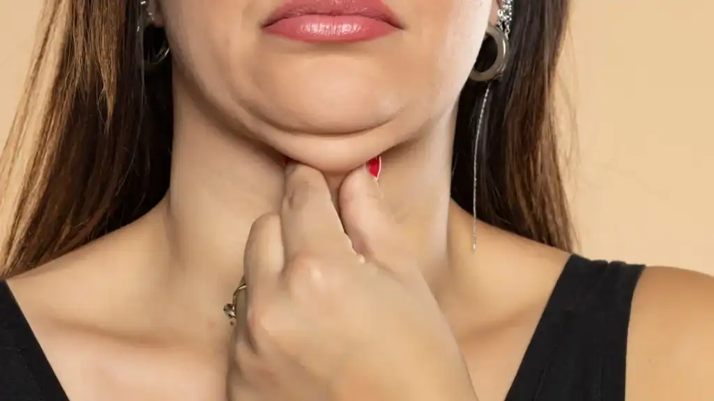 An image of a woman with double chin, sad, worried : Non Surgical Double Chin Removal Treatment in Reading, UK